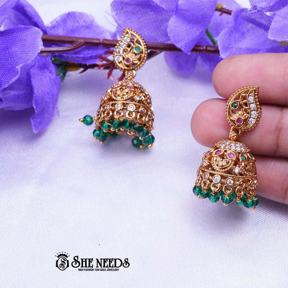 Antique gold jhumka earrings with CZ stones and Green Beads drops traditional jewellery by She Needs Jewellery