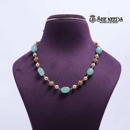 Mint Pearl Elegance Necklace featuring mint green oval stones, pearl beads, decorative gold spacer beads, and a premium gold finish | She Needs Jewellery