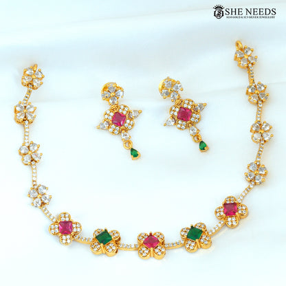 Multicolor floral gold-plated necklace set with ruby, green and white stones and matching earrings|She Needs Jewellery
