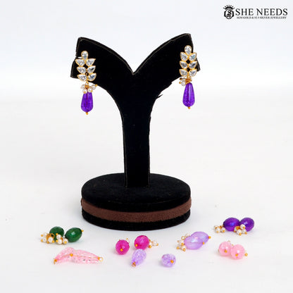 Pair of Myra leaf vine interchangeable drop earrings with white stones and multicolour bead drops on a black jewellery stand|She Needs Jewellery
