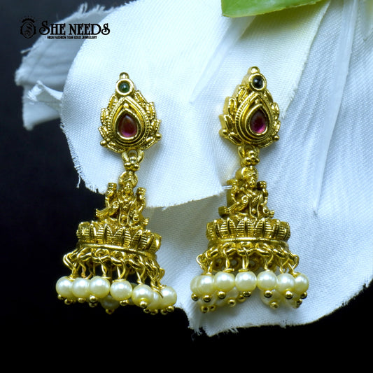 Antique gold Nakshi Temple Jhumka earrings featuring Goddess Lakshmi motifs, ruby and green stone accents, intricate temple jewelry craftsmanship, and dangling pearl drops |She Needs Jewellery