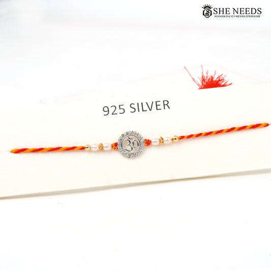 Om Divine 925 silver Rakhi with pearl beads, sparkling stones and red-yellow braided thread|She Needs Jewellery
