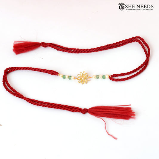 Traditional Red Thread Silver Rakhi with Green Beads & Floral Gold Motif