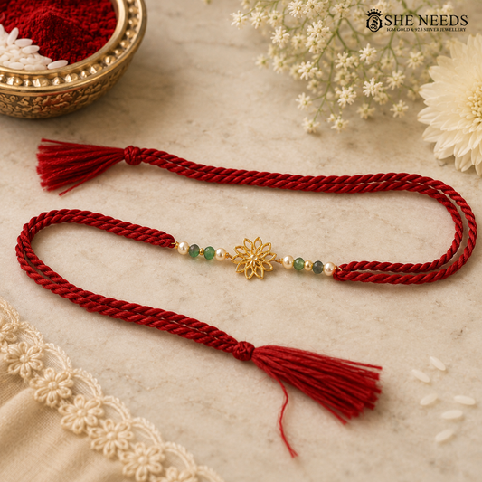 Traditional Red Thread Silver Rakhi with Green Beads & Floral Gold Motif