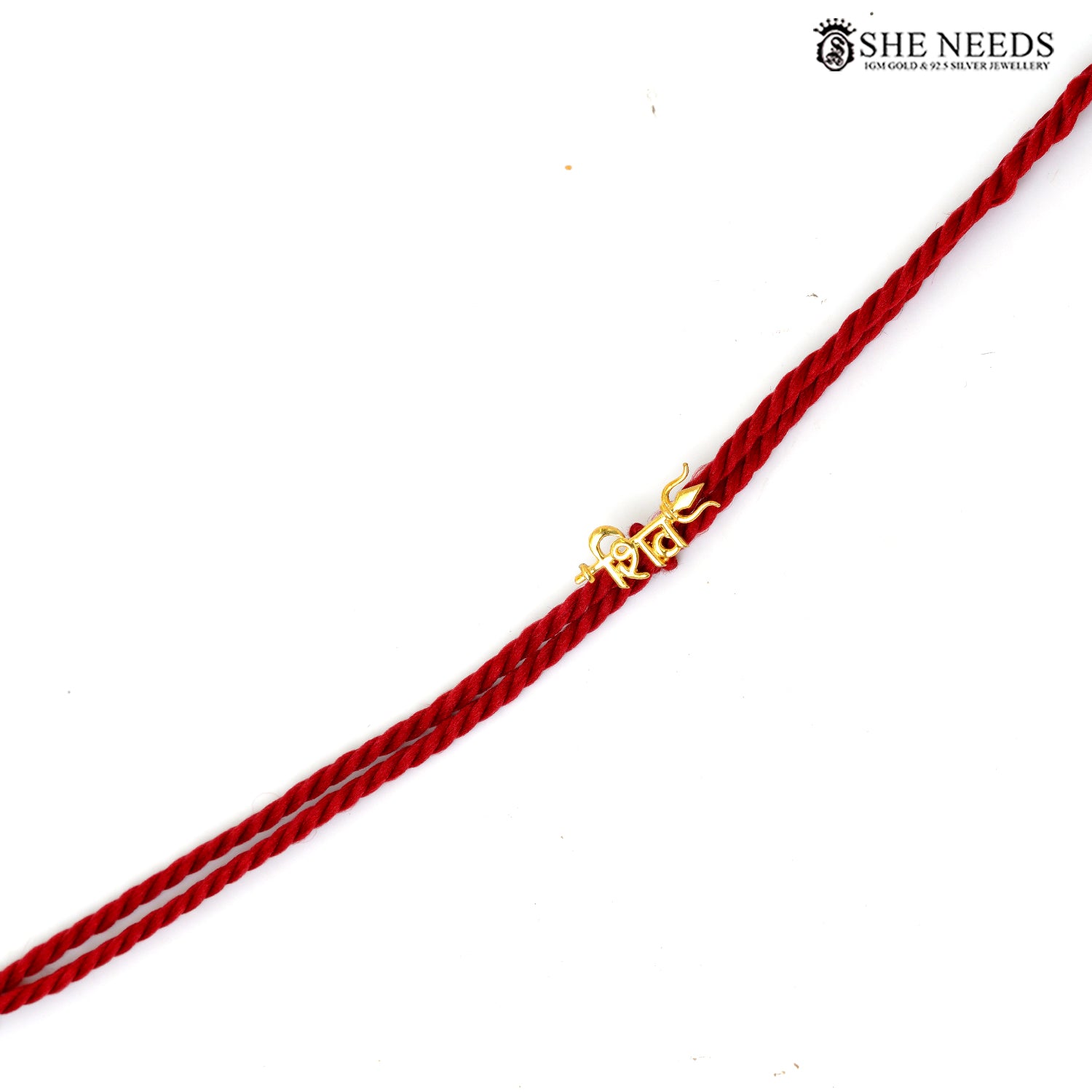 Traditional red thread Shiva Rakhi featuring Hindi “शिव” motif with silver base and gold finish.