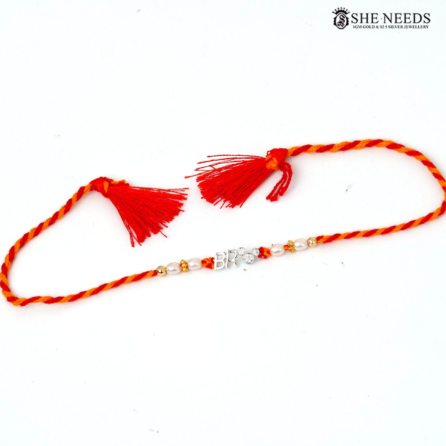 925 silver Rakhi with red and yellow braided thread, pearl beads, sparkling stones and BRO center charm.