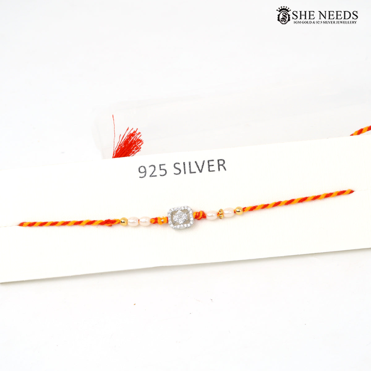 Silver Rakhi with Pearl Beads, CZ Stones & Red Yellow Thread