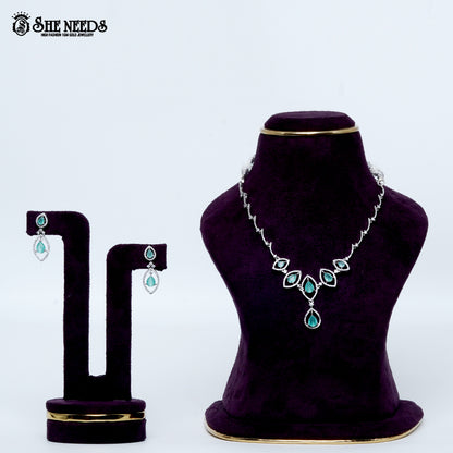 Midnight rhodium silver necklace with light green stone teardrop design| She Needs Jewellery