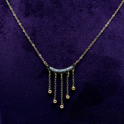 Crystal drop curve gold necklace by She Needs Jewellery