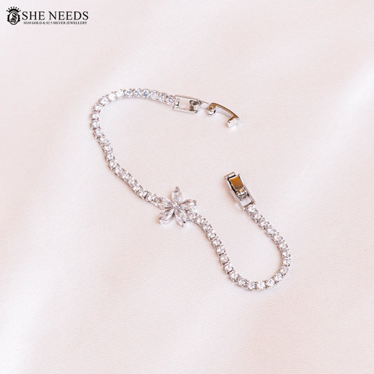 Silver CZ tennis bracelet with floral center design by She Needs Jewellery