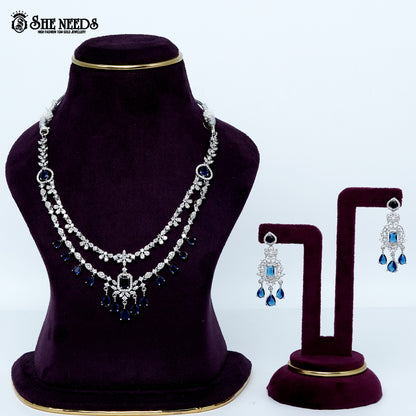 Ethereal layered blossom rhodium silver necklace with floral design and center pendant