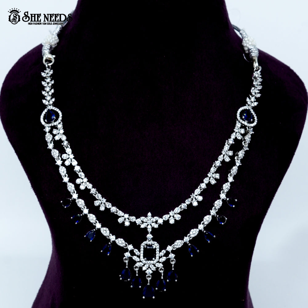 Ethereal layered blossom rhodium silver necklace with floral design and center pendant