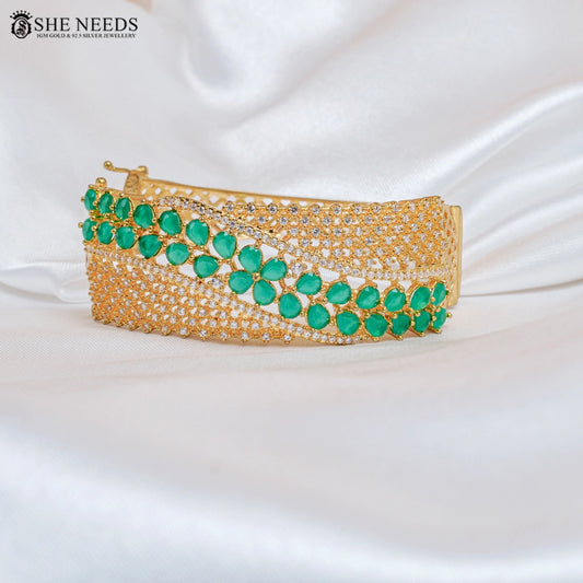 Heavy look gold cuff bracelet with green stones for women | She Needs Jewellery