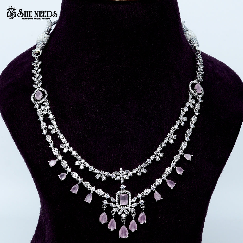 Ethereal layered blossom rhodium silver necklace with floral design and center pendant