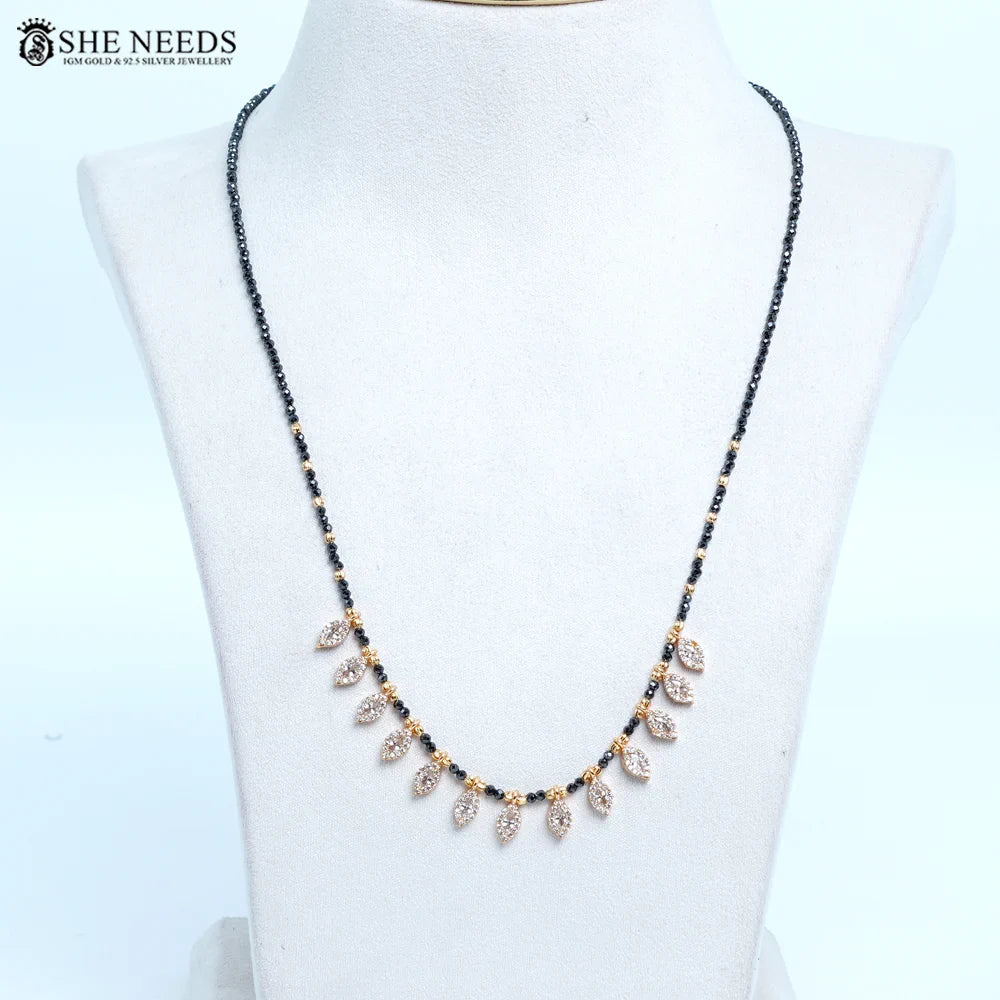 Black beads mangalsutra with CZ leaf drop design by She Needs Jewellery