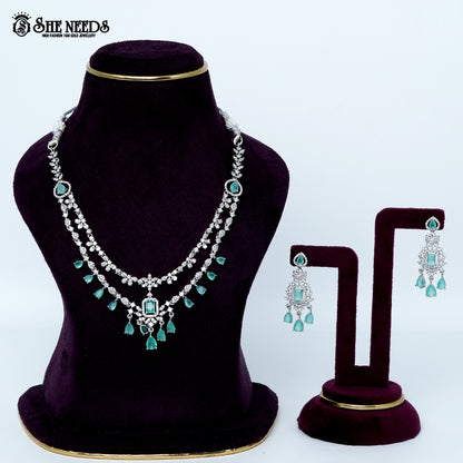 Ethereal layered blossom rhodium silver necklace with floral design and center pendant