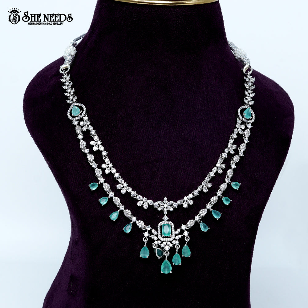 Ethereal layered blossom rhodium silver necklace with floral design and center pendant