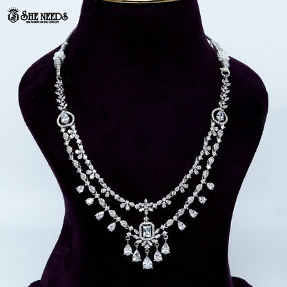Ethereal layered blossom rhodium silver necklace with floral design and center pendant