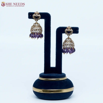 Royal purple crystal antique jhumka earrings by She Needs Jewellery