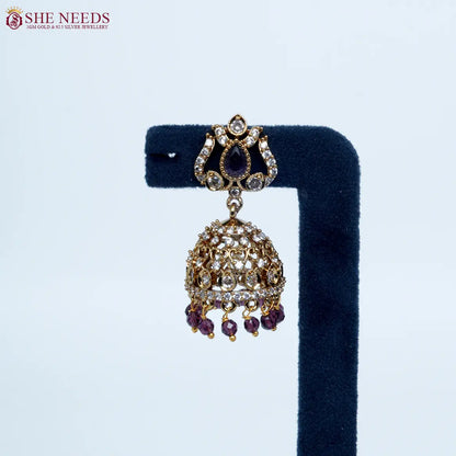 Emerald Purple crystal antique jhumka earrings by She Needs Jewellery