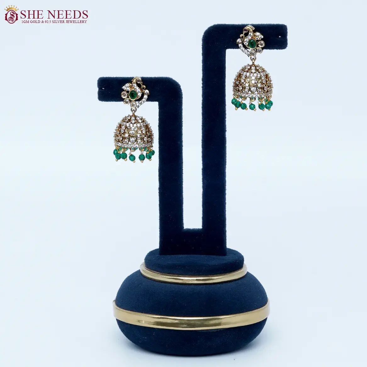 Emerald green crystal antique jhumka earrings by She Needs Jewellery