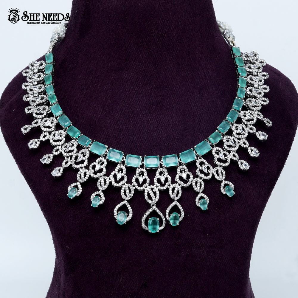 Majestic loop crest rhodium silver statement necklace with cascading drop design