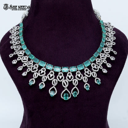 Majestic loop crest rhodium silver statement necklace with cascading drop design
