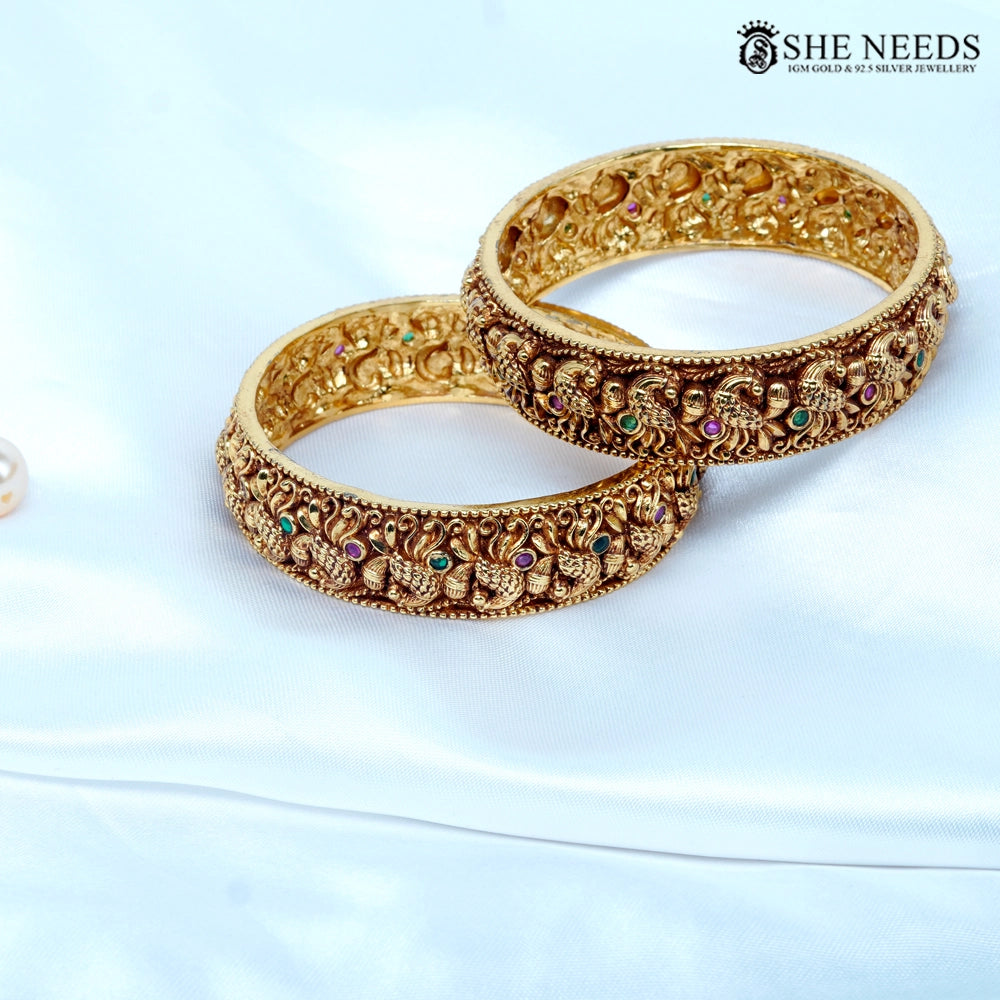 Antique nakshi peacock temple bangles with multicolor stones by She Needs Jewellery