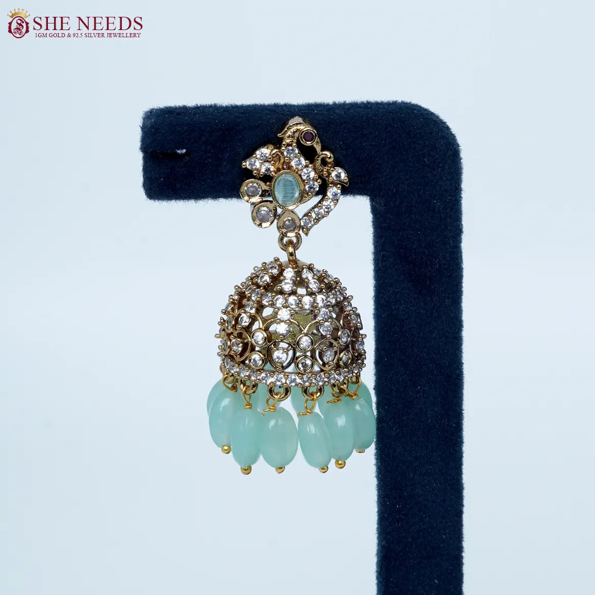 Emerald Light green crystal antique jhumka earrings by She Needs Jewellery