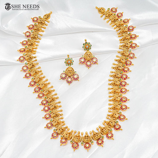 Temple design gold necklace set with Lakshmi motifs and ruby green stones by She Needs Jewellery