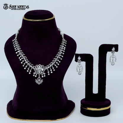 Celestial blossom vine rhodium silver necklace with floral center and cascading design
