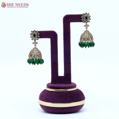 Royal amethyst crystal dome jhumka earrings with green bead drops by She Needs Jewellery