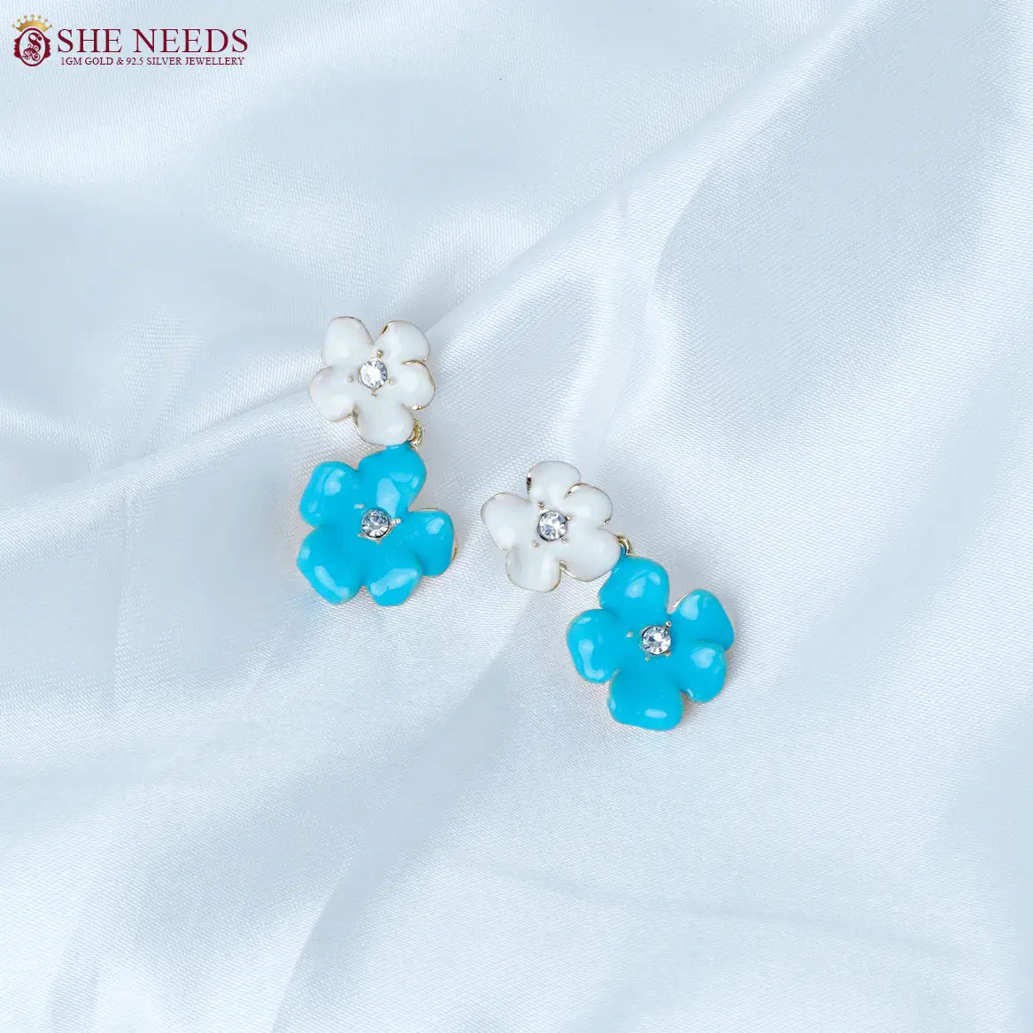 Blue and white enamel duo flower fancy earrings by She Needs Jewellery