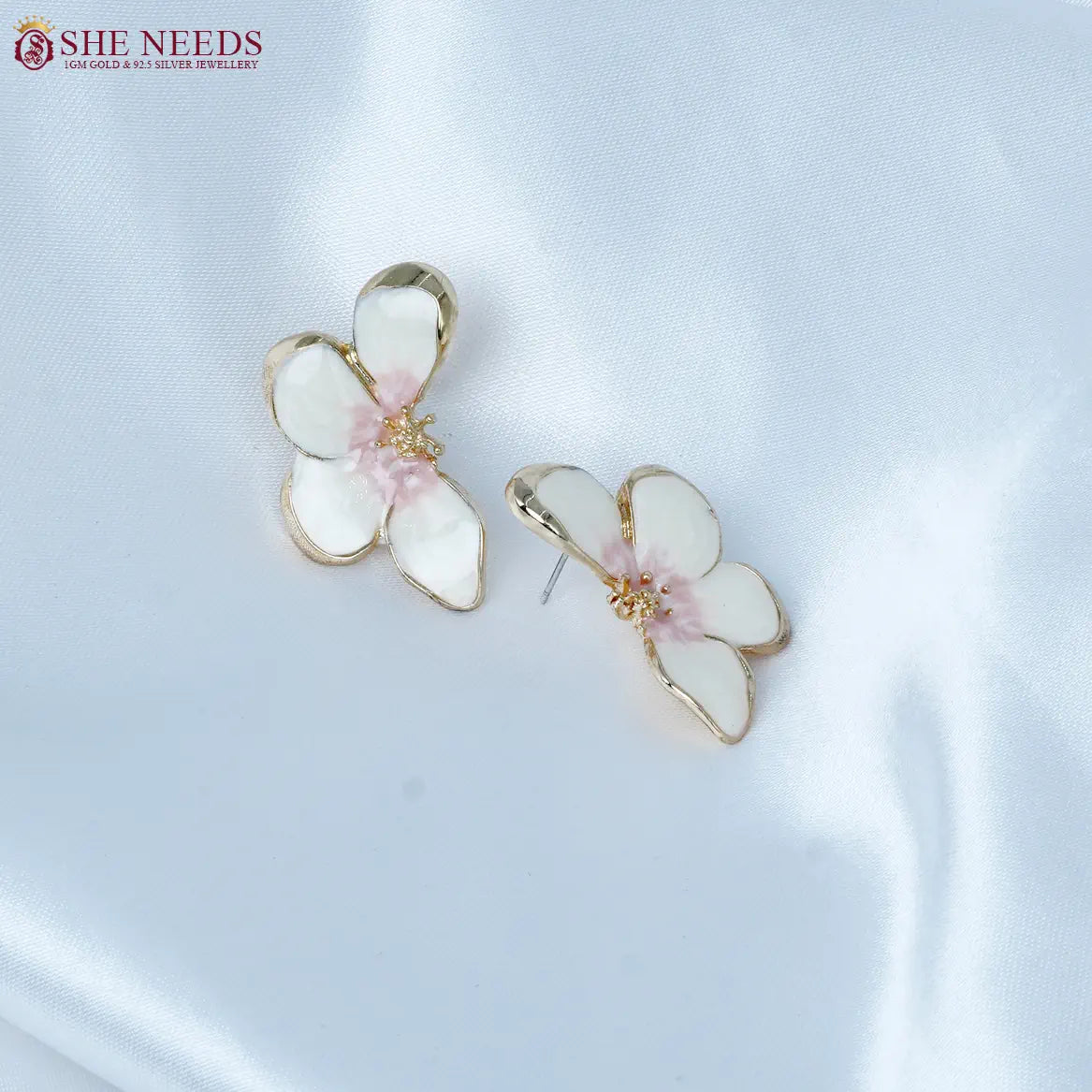White enamel floral fancy earrings by She Needs Jewellery