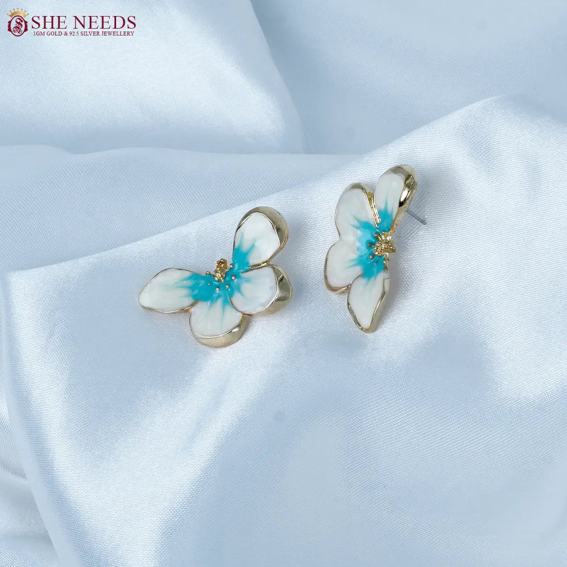 White and aqua blue enamel floral fancy earrings by She Needs Jewellery
