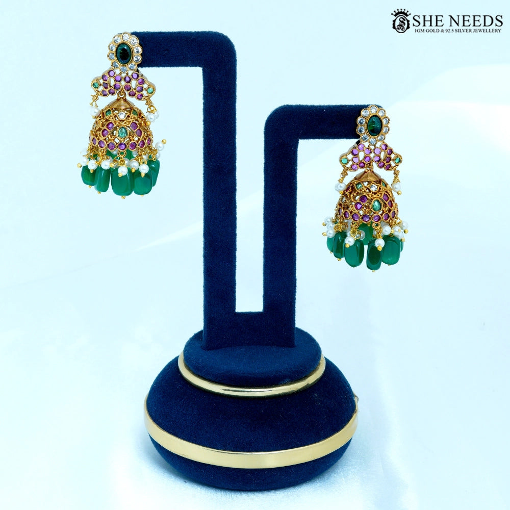 Pair of Padmika Antique Gold Temple Jhumka Earrings with lotus-inspired floral motif, ruby-colored stones, American Diamonds, pearl accents, and green bead drops.|She Needs Jewellery
