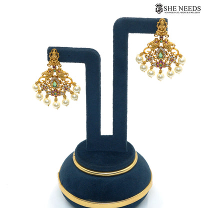 Peacock Lakshmi Pearl antique gold earrings with Goddess Lakshmi and peacock motifs, colourful stones and pearl drops|She Needs Jewellery

