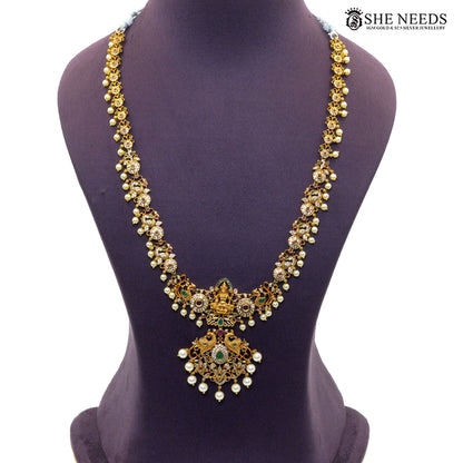 Peacock Lakshmi Pearl antique gold long necklace with Goddess Lakshmi pendant, peacock motifs, colourful stones and pearl drops|She Needs Jewellery