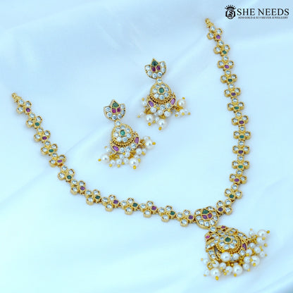 Full view of Pushpangi Gold Plated American Diamond Floral Necklace Set with matching pearl jhumka earrings, featuring floral CZ motifs, ruby and green stones, and elegant pearl drops.|She Needs Jewellery
