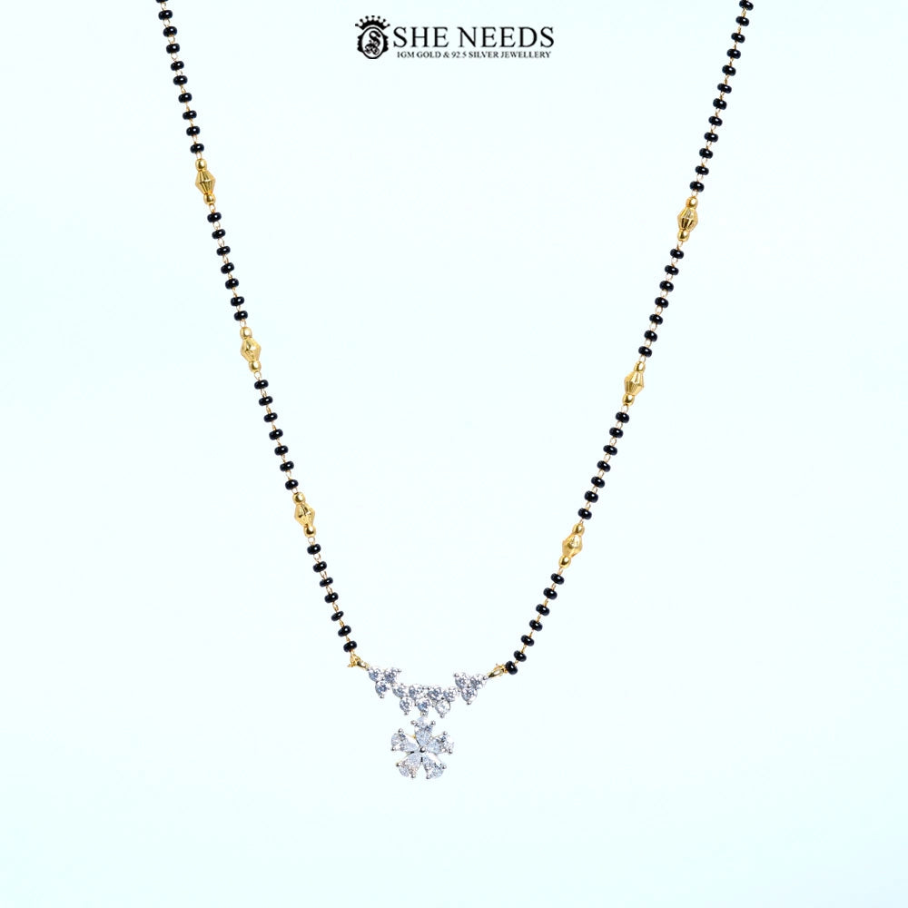 Full view of Pushpanjali Gold Plated AD Floral Mangalsutra featuring a sparkling American Diamond flower pendant with black bead chain.|She Needs Jewellery
