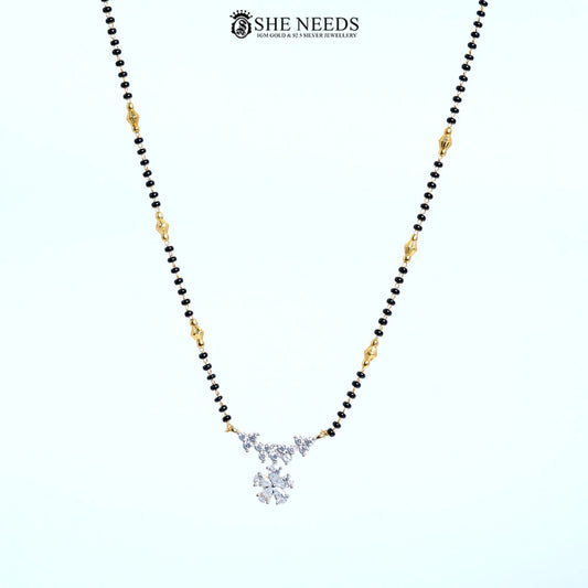 Full view of Pushpanjali Gold Plated AD Floral Mangalsutra featuring a sparkling American Diamond flower pendant with black bead chain.|She Needs Jewellery
