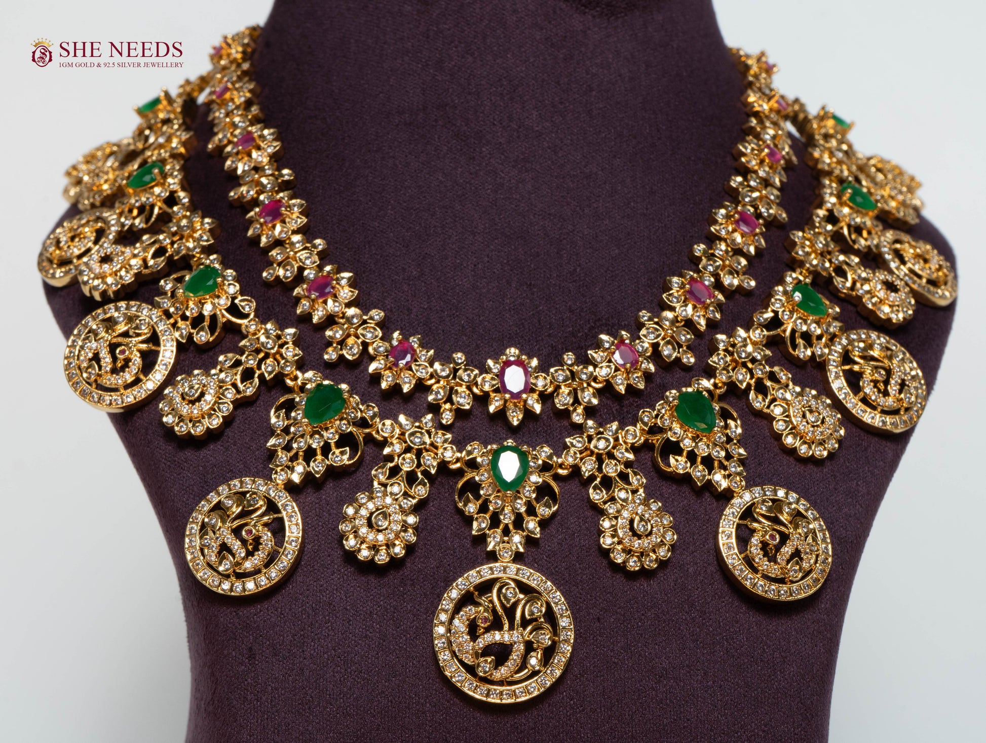 Rajeshwari Lakshmi coin bridal necklace set with American Diamonds, emerald and ruby stones and matching earrings