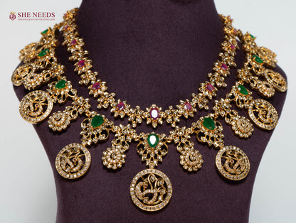 Rajeshwari Lakshmi coin bridal necklace set with American Diamonds, emerald and ruby stones and matching earrings