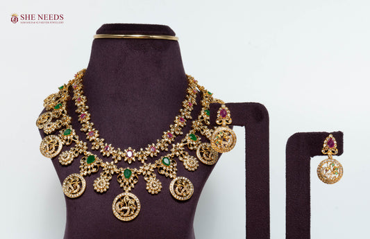 Rajeshwari Lakshmi coin bridal necklace set with American Diamonds, emerald and ruby stones and matching earrings