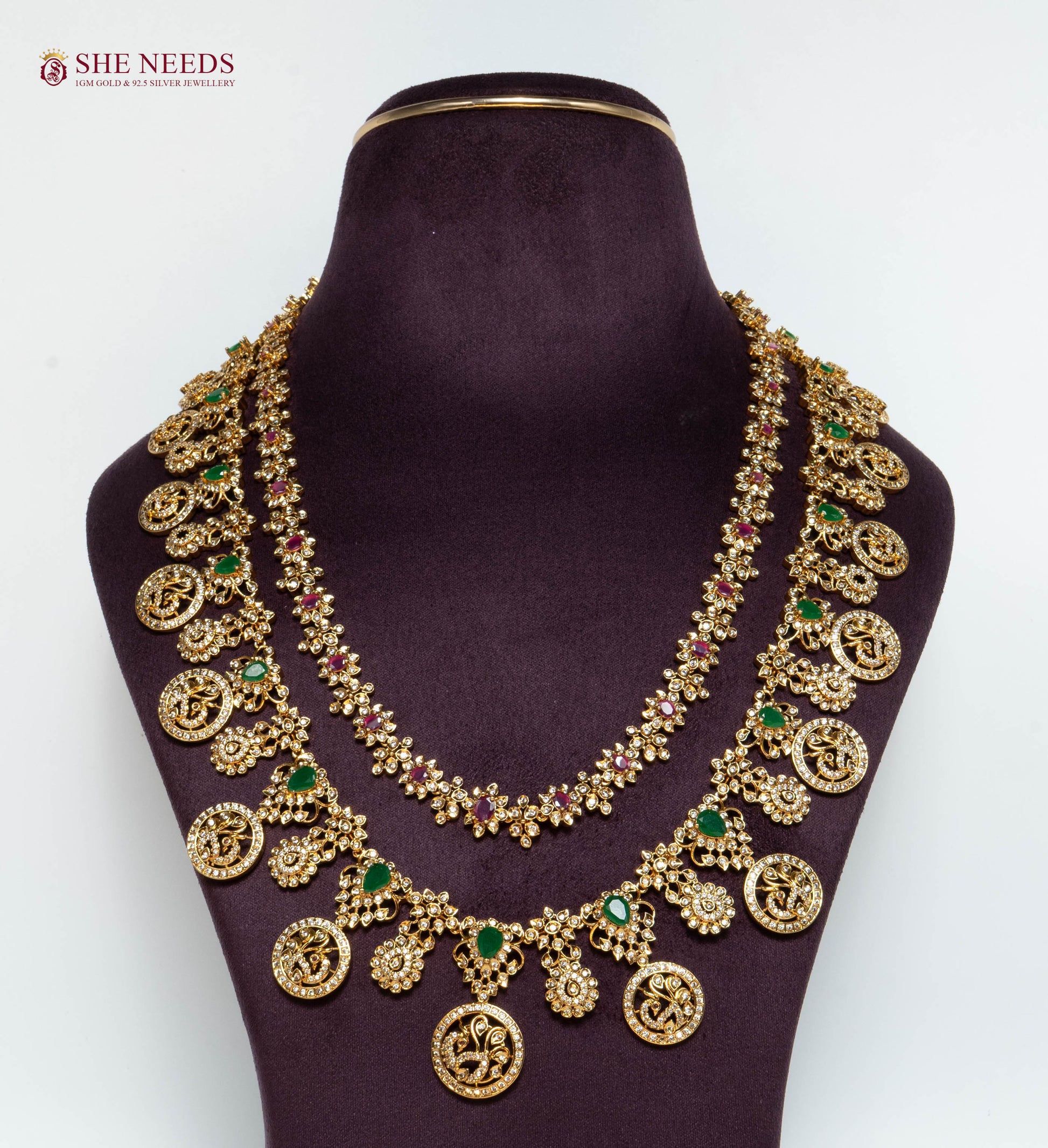 Royal Antique Lakshmi Long Haram Necklace Set with Lakshmi Coin Motifs, Ruby and Emerald Stones, Matching Earrings, and Antique Gold Finish