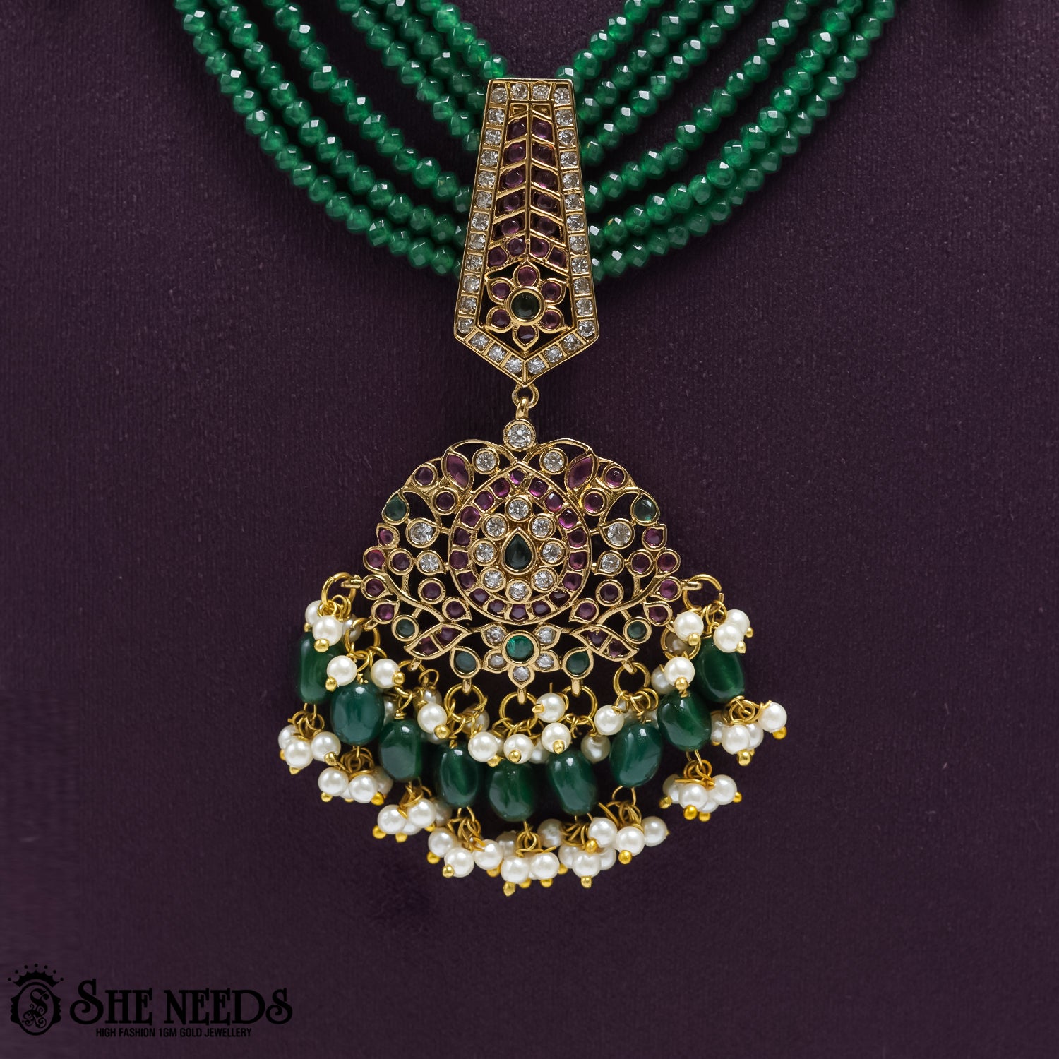 Royal Emerald Pearl Drop Earrings with emerald bead drops and pearl detailing