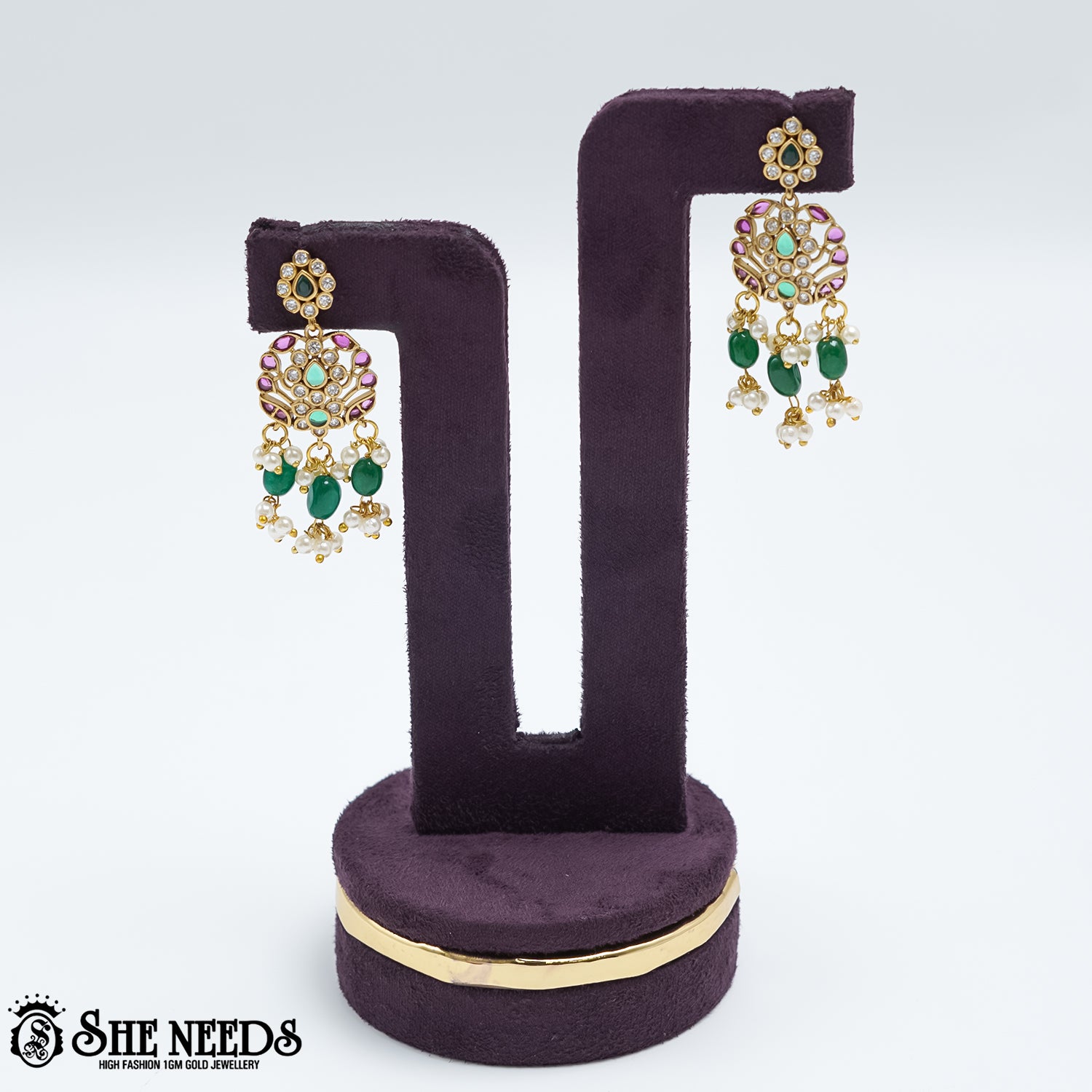 Royal emerald pearl drop earrings with pink stones and gold polish