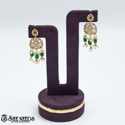 Royal emerald pearl drop earrings with pink stones and gold polish
