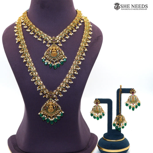 Royal Lakshmi emerald temple necklace set with layered necklace design, green stones, ruby accents, pearl drops and matching earrings|She Needs Jewellery
