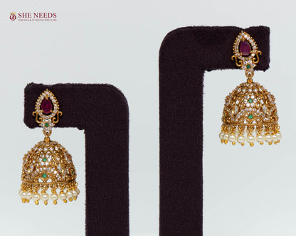 Royal Ruby Pearl Jhumka Earrings with American Diamonds, ruby teardrop stone, green accents and pearl drops by She Needs Jewellery